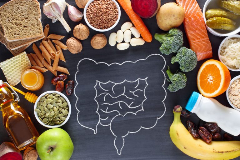 Food arranged around an illustration of the gut